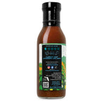 The description side of a bottle of Stanky Sauce Florida Sunshine BBQ Sauce. Shows a heat meter, food pair recommendation along with business and social media information. Includes a a notice to shake well and refrigerate after opening as well as a Made in Florida logo.