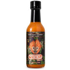 A bottle of Stanky Sauce Honey Mango Habanero Hot Sauce with a black cap and a dark label featuring an orange monkey mascot image, on a white background.