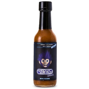 A bottle of Stanky Sauce Sweet Jalapeño Reaper Hot Sauce with a black cap and a black label featuring a dark blue haired cartoon monkey mascot, set against a plain white background.